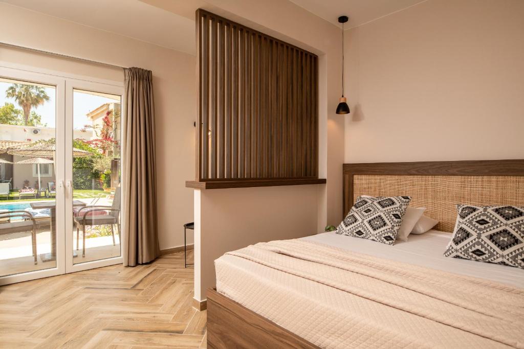 Postel nebo postele na pokoji v ubytování Aeolos Boutique Hotel & Suites