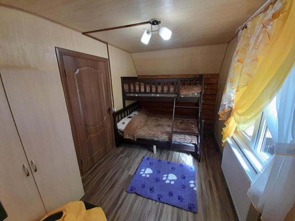 Postel nebo postele na pokoji v ubytování Садиба Срібний Вовк