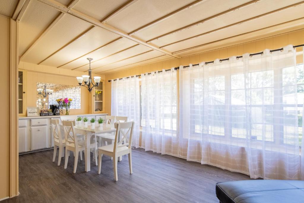 a kitchen and dining room with a table and chairs at Nature Lover's Paradise. in Zephyrhills