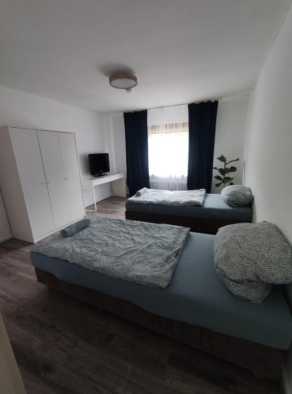 Postel nebo postele na pokoji v ubytování Gasthaus L&A Kunz