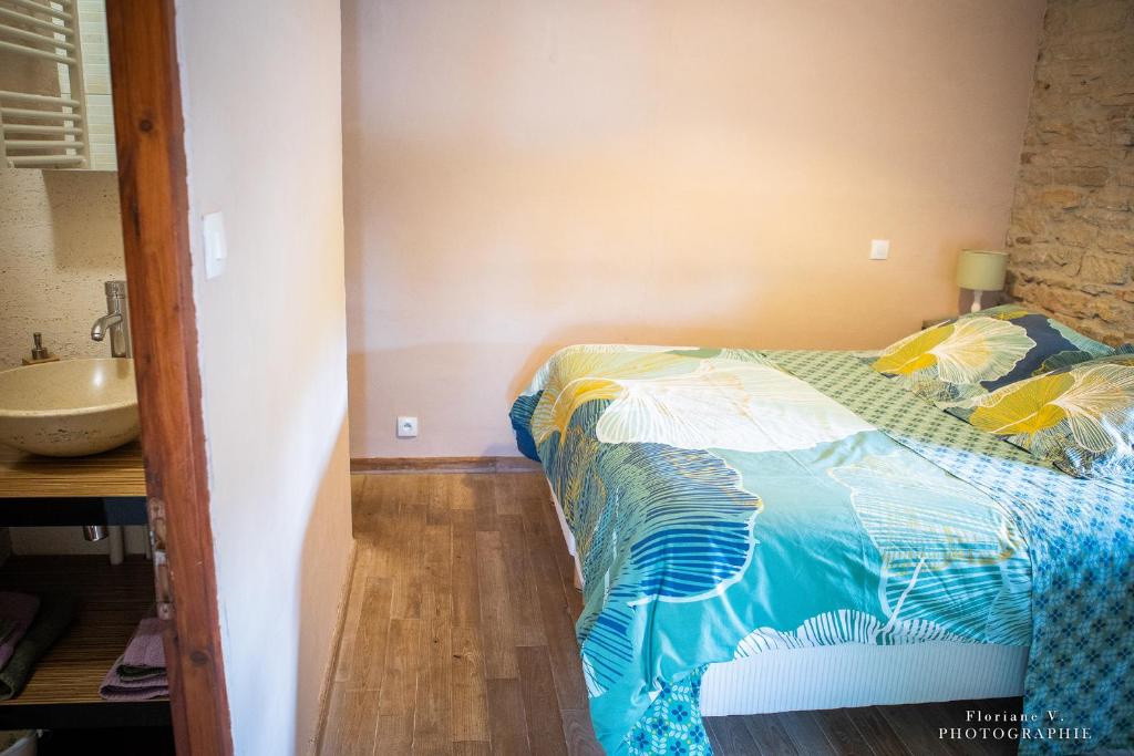 Postel nebo postele na pokoji v ubytování Aux Mésanges