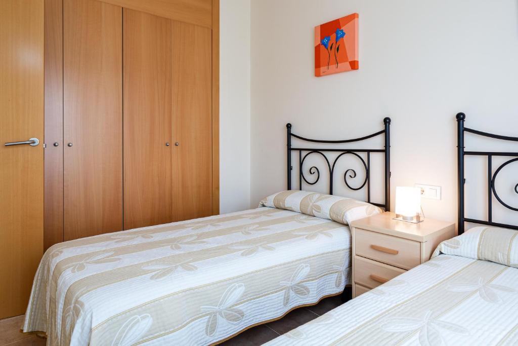 Posteľ alebo postele v izbe v ubytovaní Apartamento Narcis