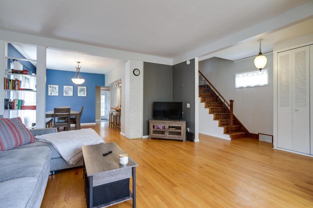 a living room with a couch and a table at Pet-Friendly Saint Paul Home - Near Allianz Field! in Saint Paul
