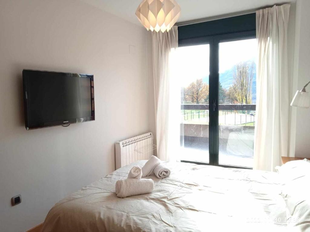 Postel nebo postele na pokoji v ubytování Apartamento Argualas V WOWRURAL