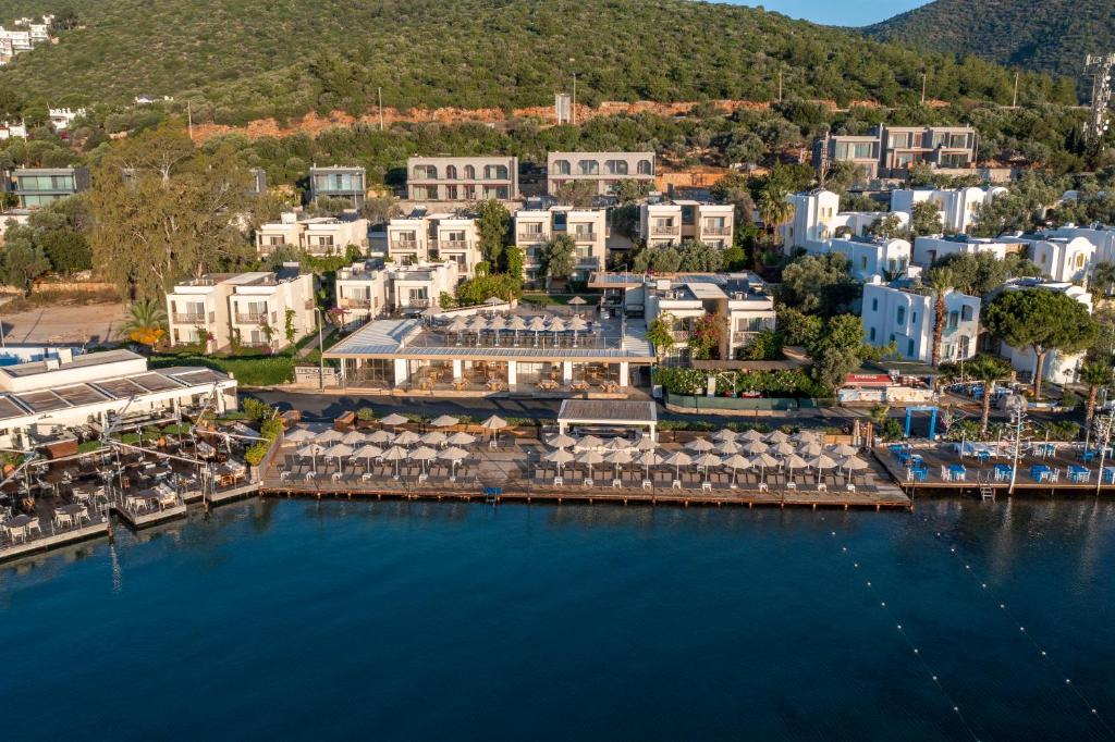 an aerial view of a resort with a marina at Trendlife Hotels Torba in Bodrum City