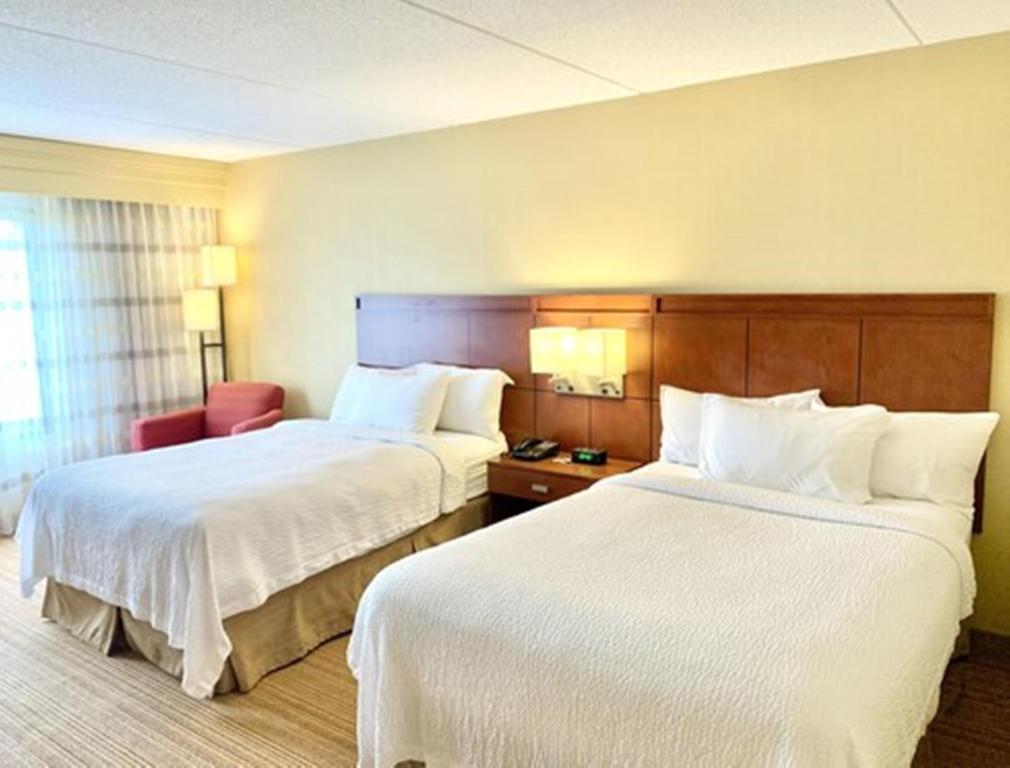 Postel nebo postele na pokoji v ubytování Courtyard by Marriott Buffalo Amherst/University
