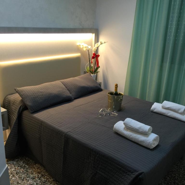 Postel nebo postele na pokoji v ubytování Hotel Ragno D'Oro