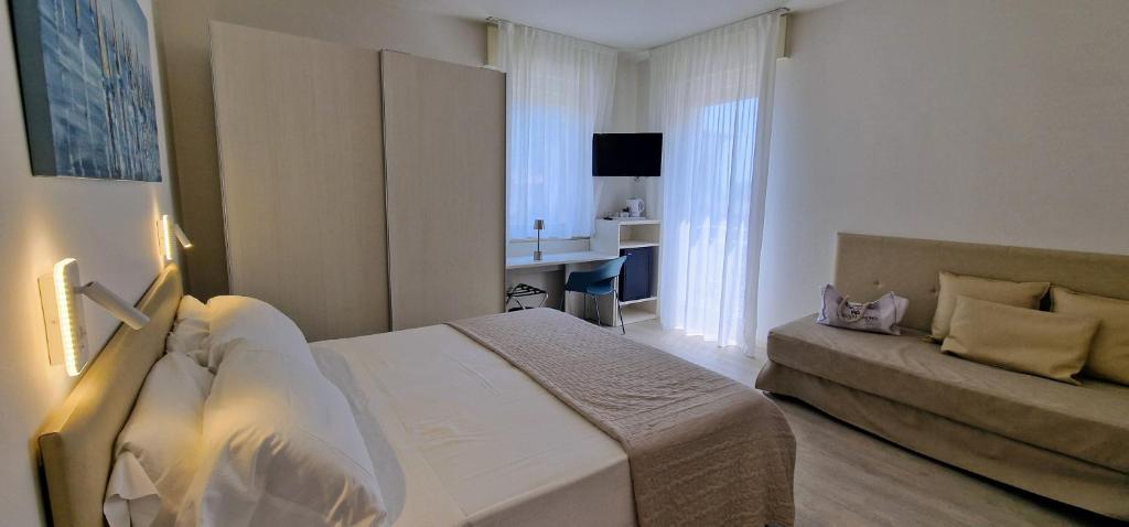Postel nebo postele na pokoji v ubytování Hotel Villa Anthea