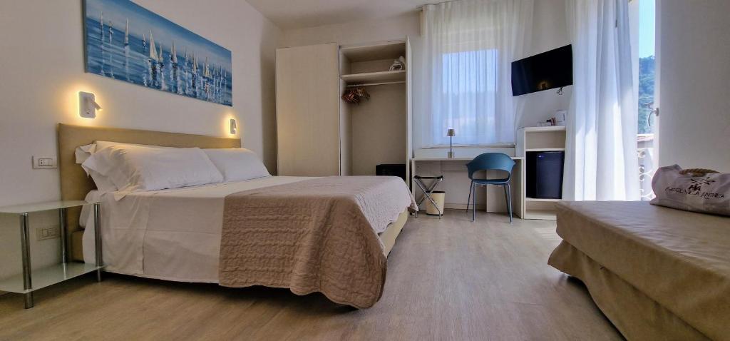 Postel nebo postele na pokoji v ubytování Hotel Villa Anthea