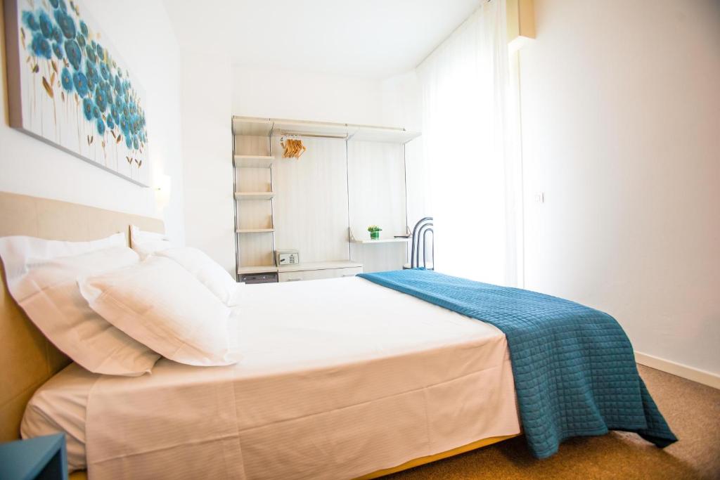 Postel nebo postele na pokoji v ubytování Hotel Villa Anthea