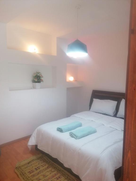 Postel nebo postele na pokoji v ubytování Akwaba lodge