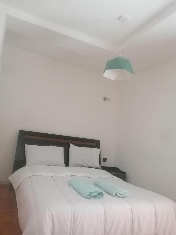 Postel nebo postele na pokoji v ubytování Akwaba lodge