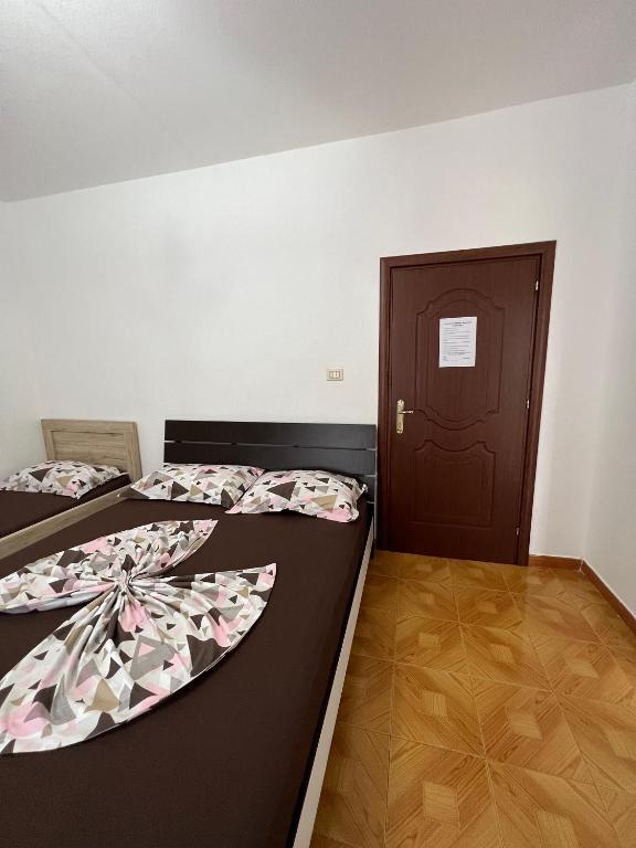 Postel nebo postele na pokoji v ubytování Apartment Kune, Shëngjin 2