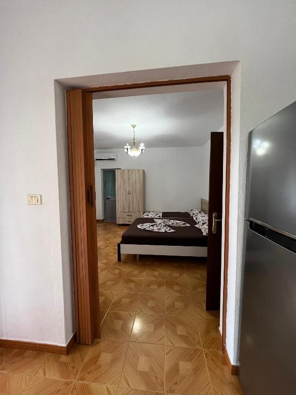 Postel nebo postele na pokoji v ubytování Apartment Kune, Shëngjin 2