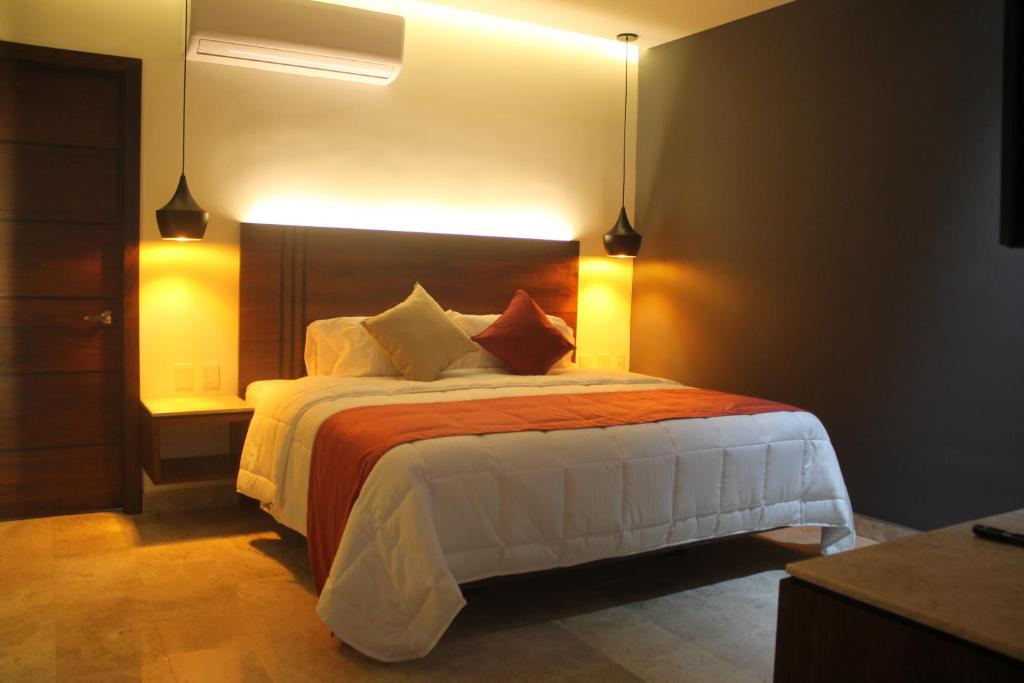 Postel nebo postele na pokoji v ubytování Hotel veinti 3 Tapachula
