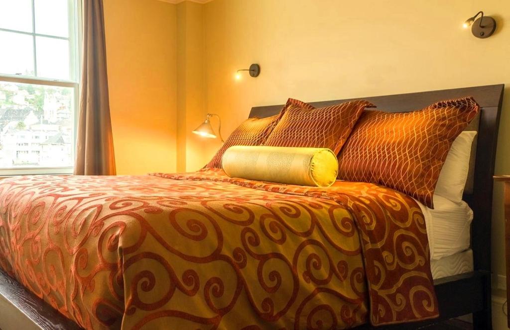 Postel nebo postele na pokoji v ubytování Hotel Elliott