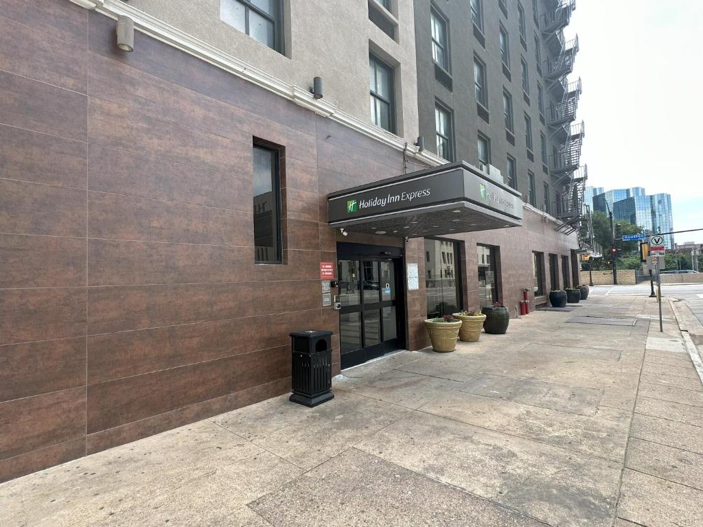 a building with a sign on the side of it at Holiday Inn Express - Dallas Downtown, an IHG Hotel in Dallas