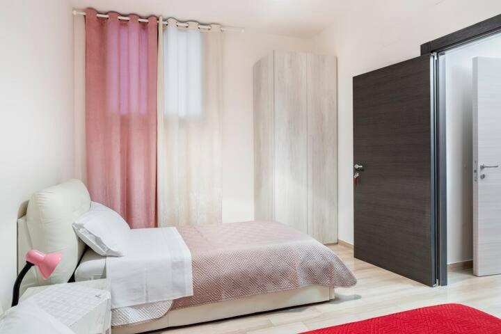 Postel nebo postele na pokoji v ubytování Muccino B&B