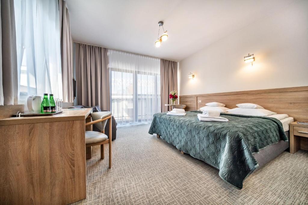 Postel nebo postele na pokoji v ubytování Sunset Spa