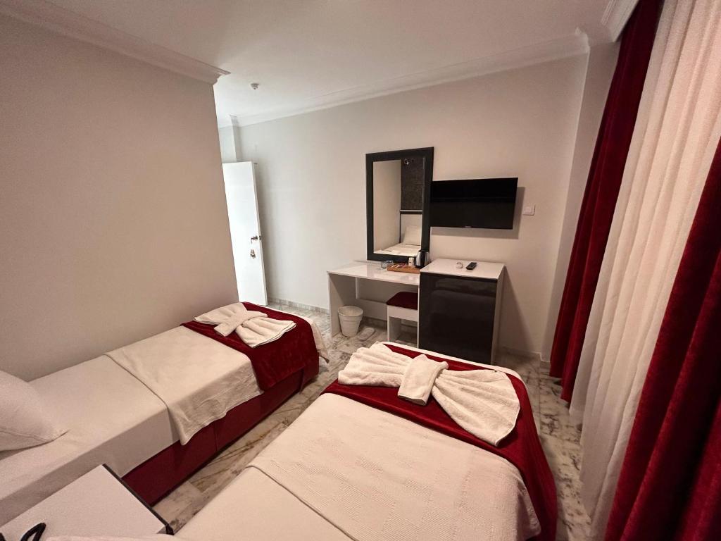 Postel nebo postele na pokoji v ubytování Bellissima Hotel