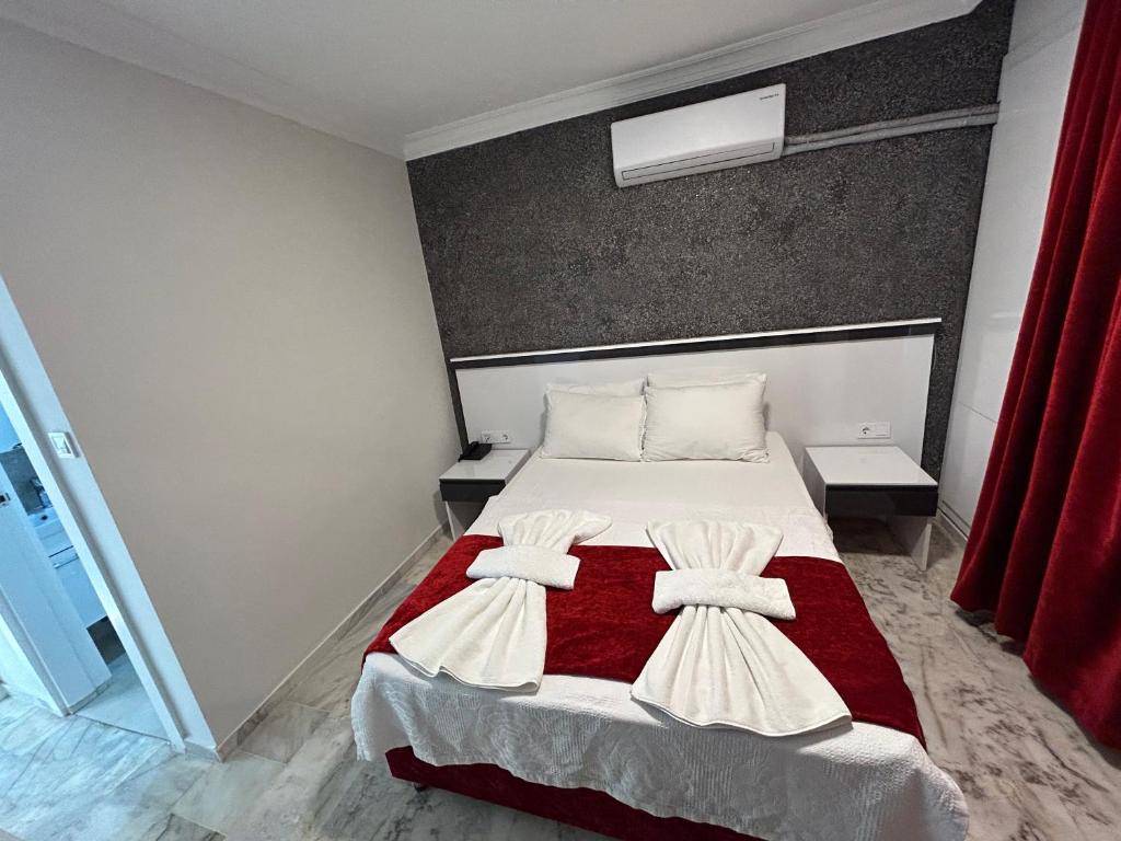 Postel nebo postele na pokoji v ubytování Bellissima Hotel