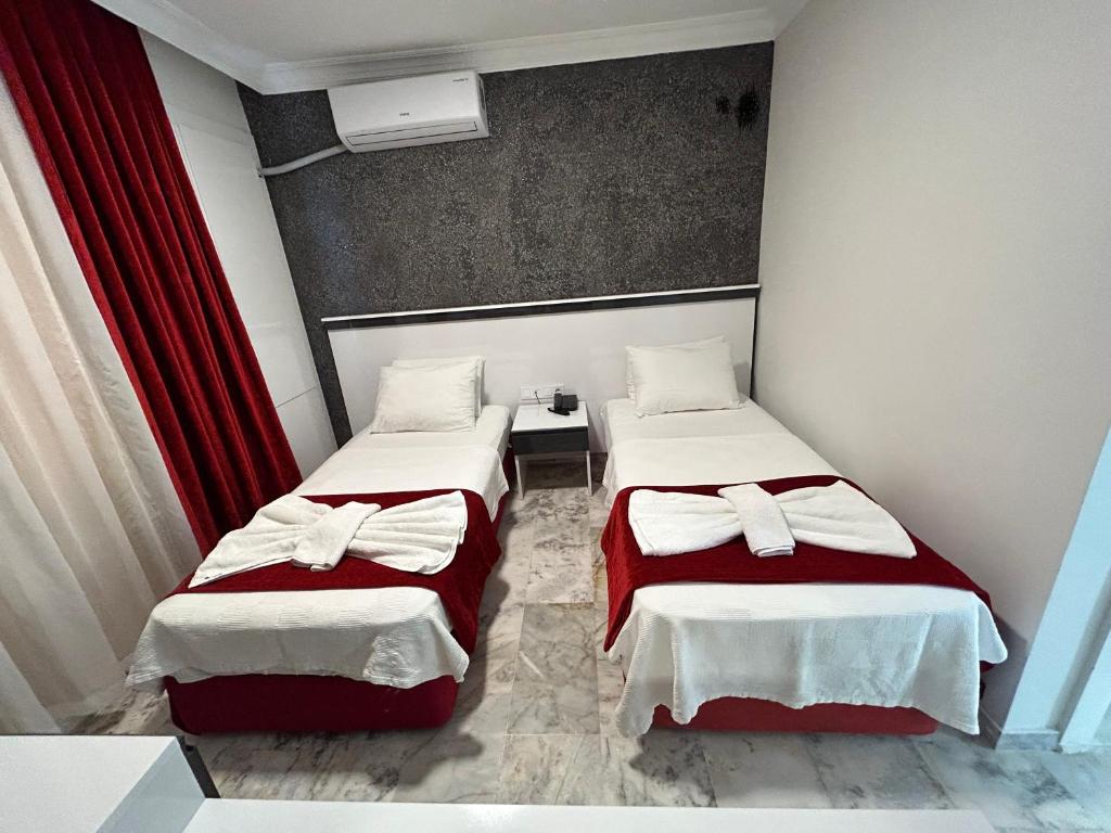 Postel nebo postele na pokoji v ubytování Bellissima Hotel