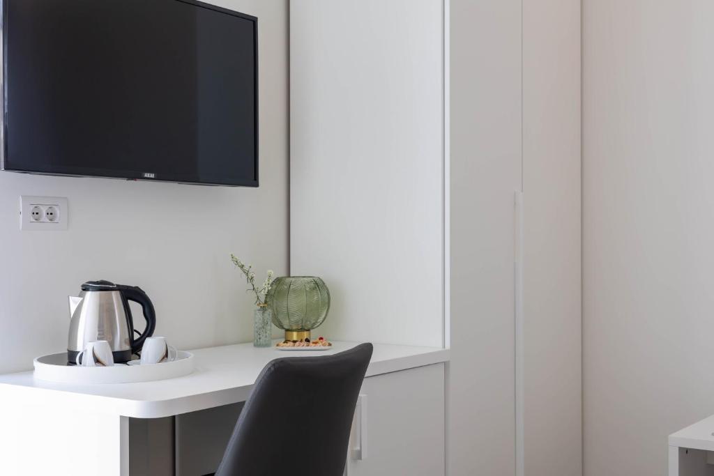 TV a/nebo společenská místnost v ubytování Marea Charme Rooms