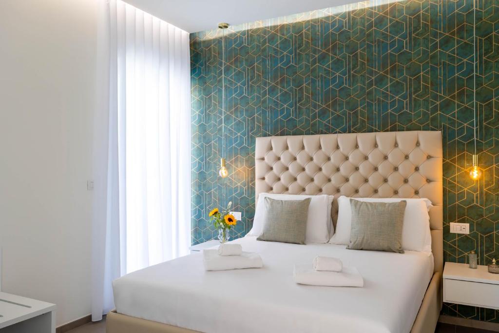 Postel nebo postele na pokoji v ubytování Marea Charme Rooms