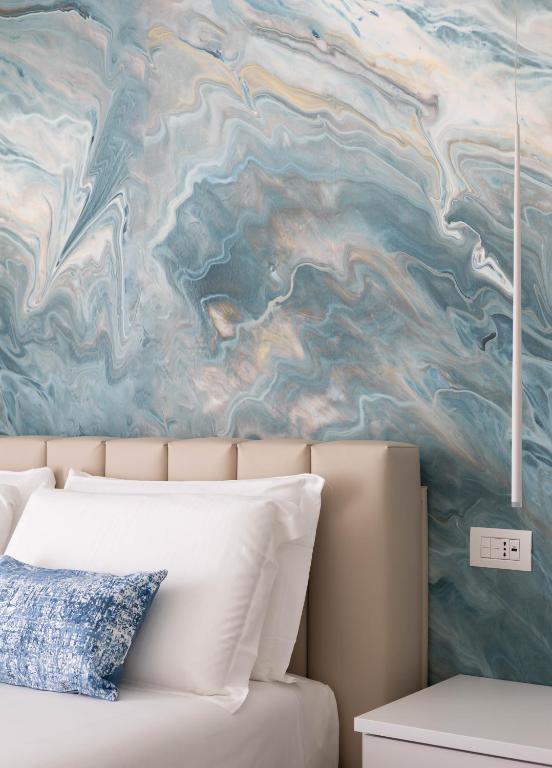 Postel nebo postele na pokoji v ubytování Marea Charme Rooms