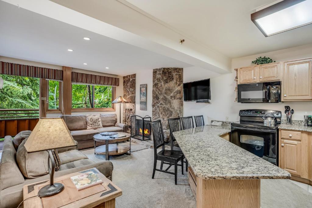 a living room with a couch and a table at Laurelwood Condominiums 307 in Snowmass Village