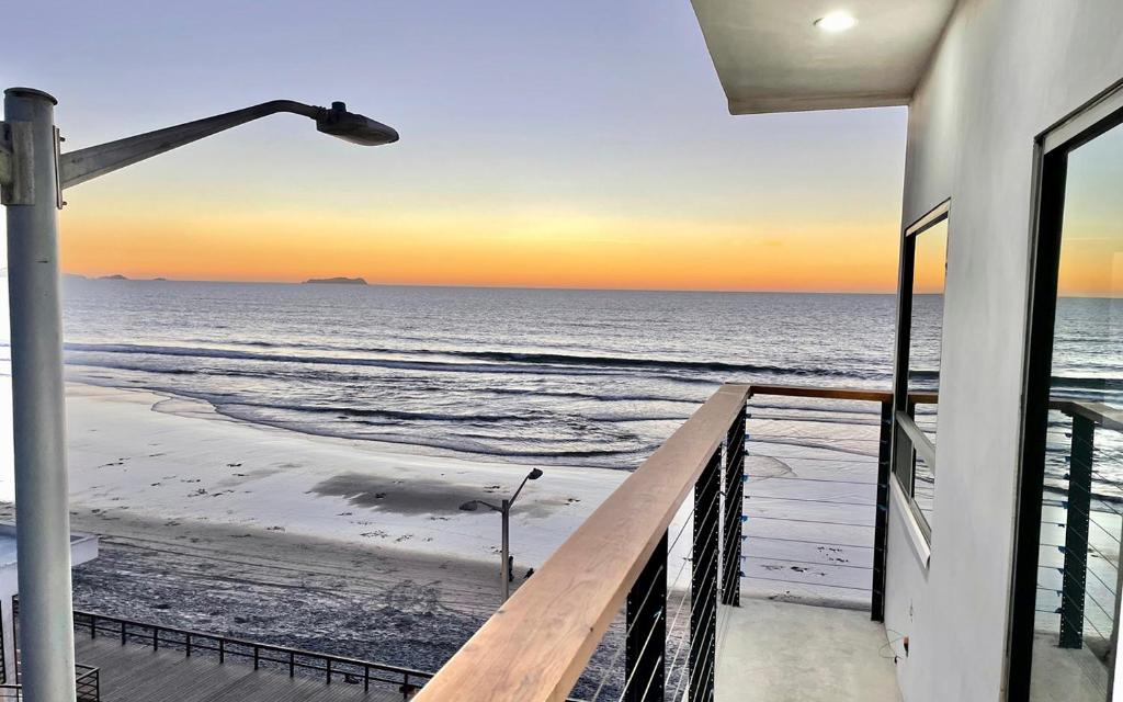 a view of the ocean from a house balcony at Lovely Beach 1-Bed unit in Playas de Tijuana in Tijuana