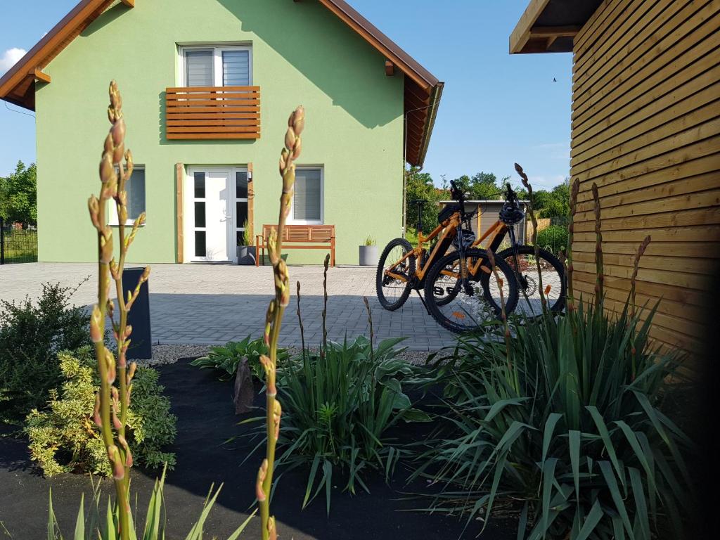 a house with two bikes parked in front of it at Holiday Home Znojmo w/ Wellness & Wine in Znojmo