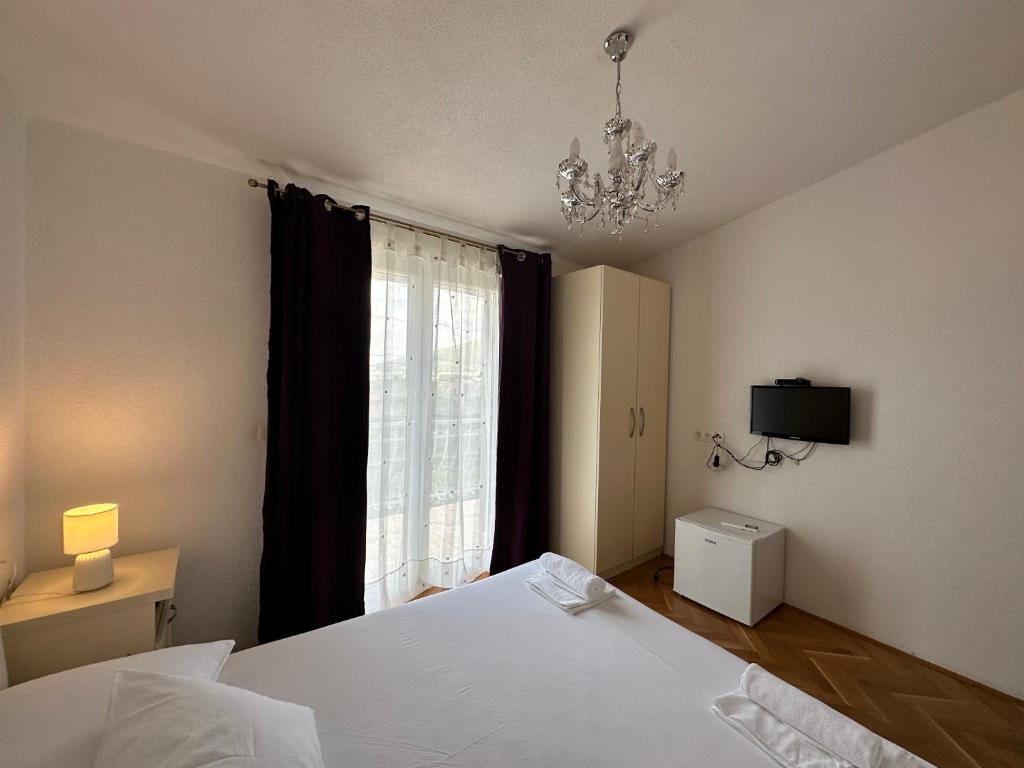 Postel nebo postele na pokoji v ubytování Villa Dante