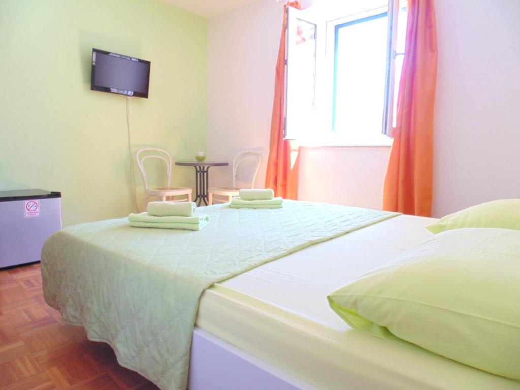 Postel nebo postele na pokoji v ubytování Guest House Petricevic