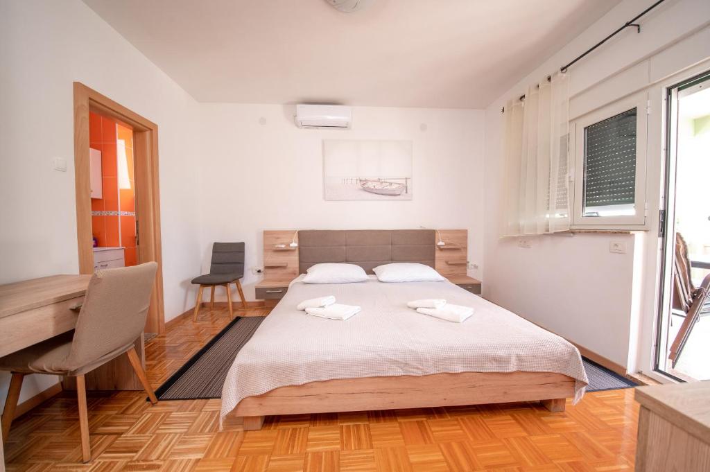 Łóżko lub łóżka w pokoju w obiekcie Apartment Prominac