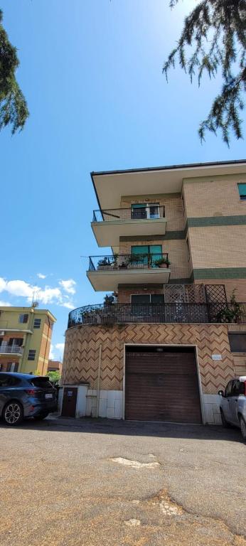 a building with a parking lot in front of it at Pisana 247 St Peter in Rome