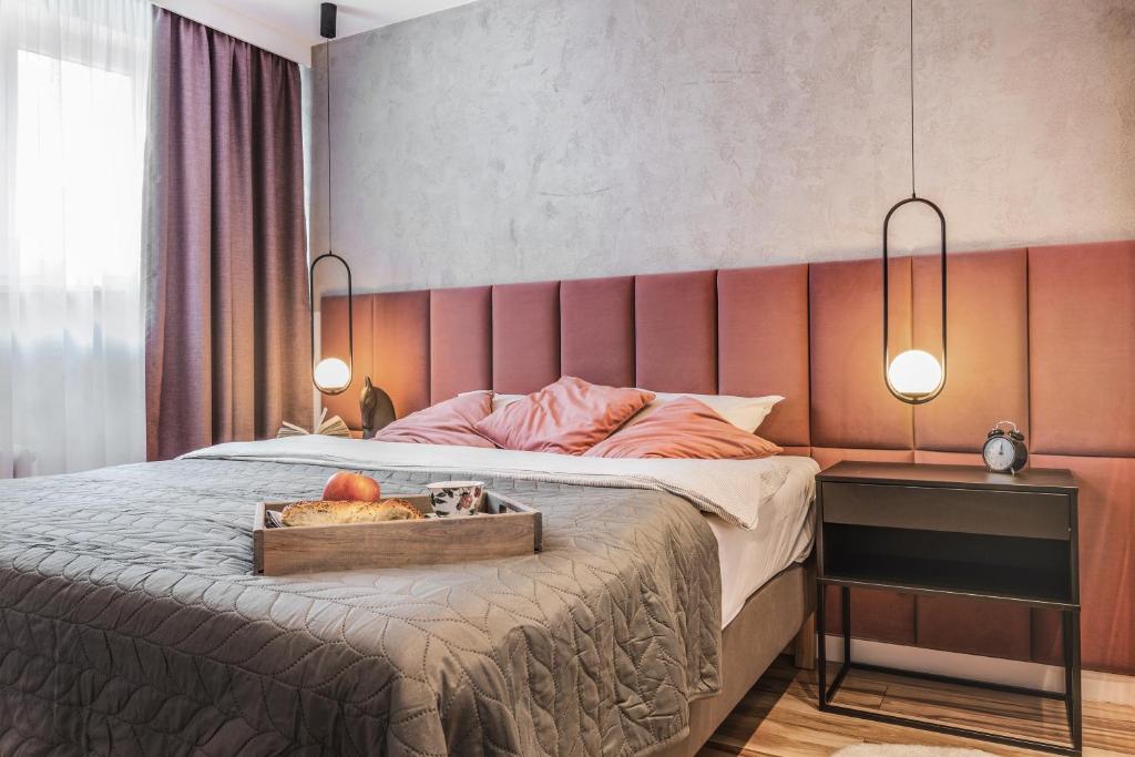 Ένα ή περισσότερα κρεβάτια σε δωμάτιο στο Stylowa oaza w sercu miasta