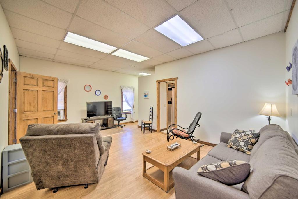 a living room with a couch and a table at Eben Junction Vacation Rental - 2 Mi to Ice Caves! in Chatham