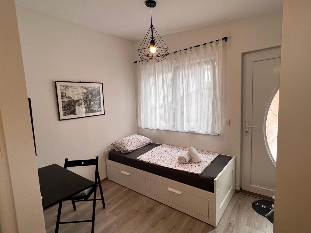 Postel nebo postele na pokoji v ubytování Guest House Kiwi Mostar