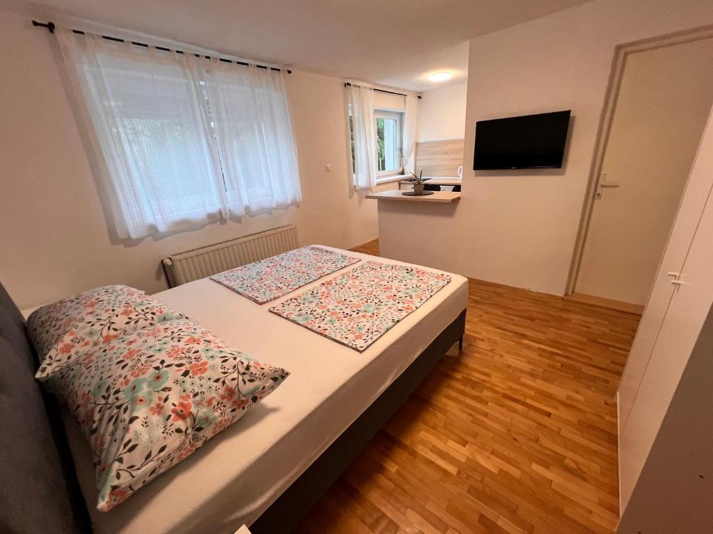 Postel nebo postele na pokoji v ubytování Guest House Kiwi Mostar