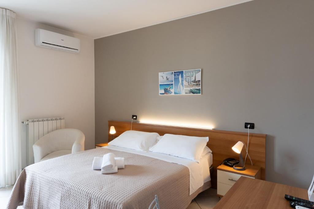 Postel nebo postele na pokoji v ubytování Hotel D'Atri