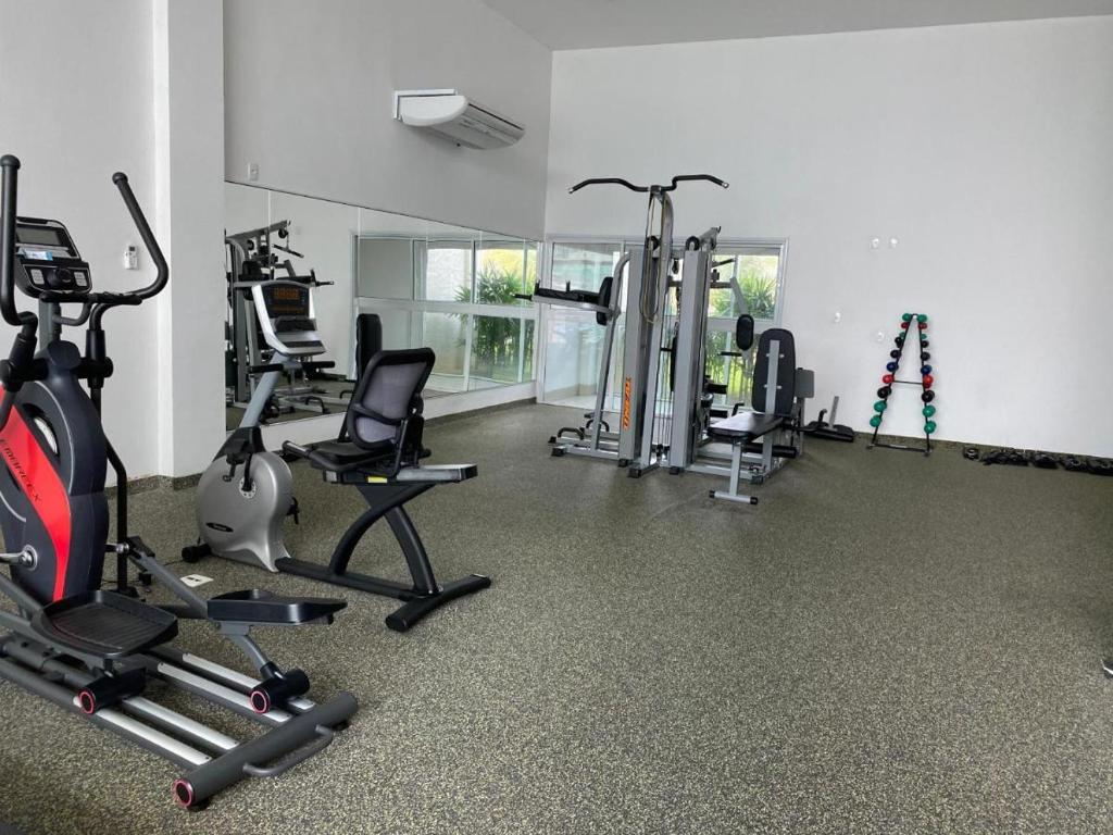 a gym with several exercise equipment in a room at Muro alto condomínio clube in Ipojuca