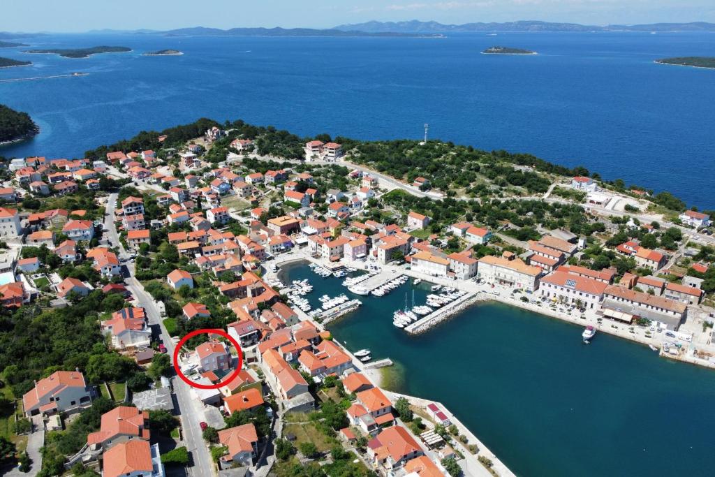 an aerial view of a town with a marina at Apartments by the sea Sali, Dugi otok - 19880 in Sali