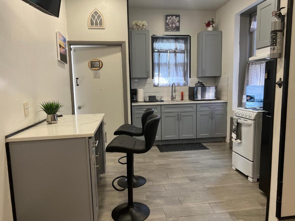 a kitchen with a counter and a chair in it at F.M.T. in Harrisburg