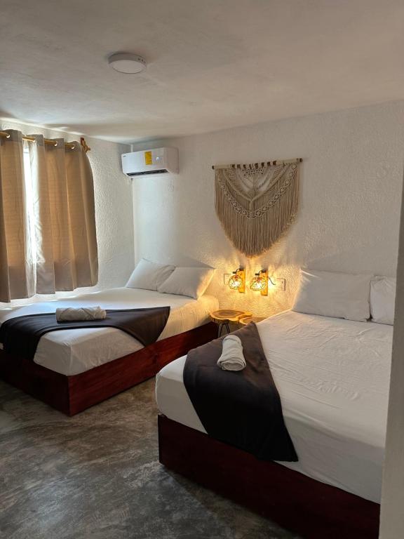 Postel nebo postele na pokoji v ubytování Hotel and hostel KAB