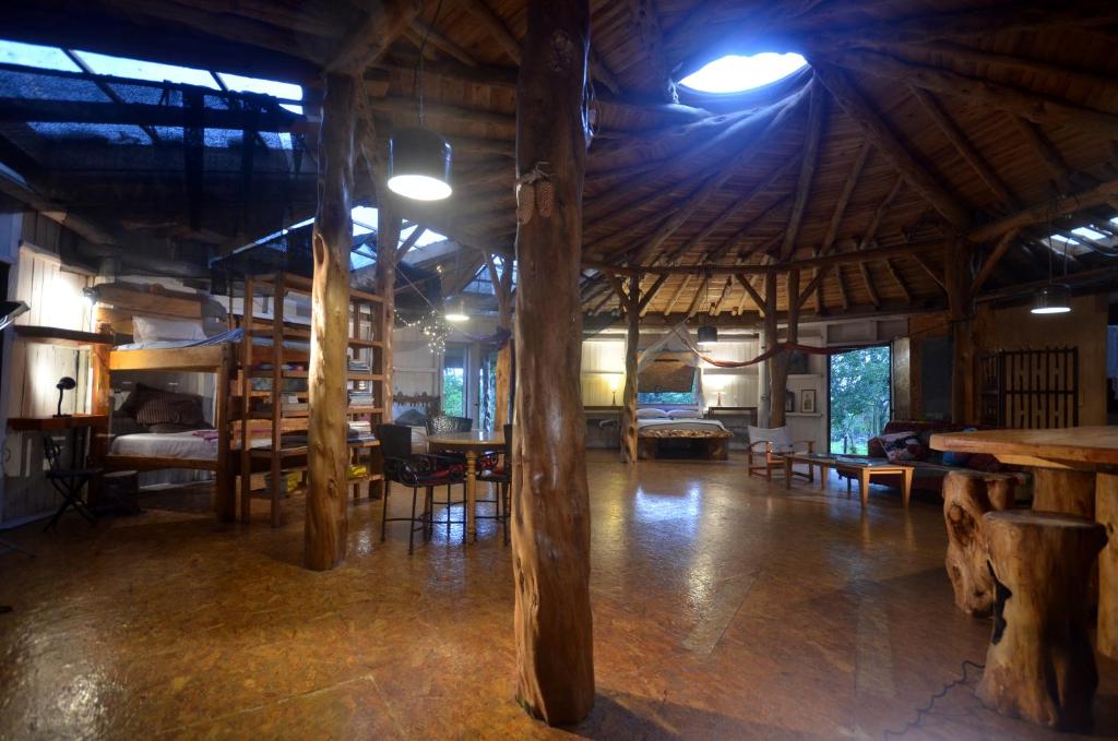 a large room with tables and chairs in a building at EcoRoundHouse in Filandia