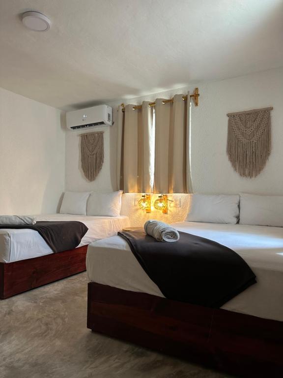 Postel nebo postele na pokoji v ubytování Hotel and hostel KAB