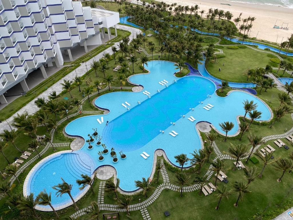 an aerial view of the pool at the resort at Resort's full Service Apartment - near the airport Cam Ranh, Nha Trang, Khanh Hoa in Miếu Ông