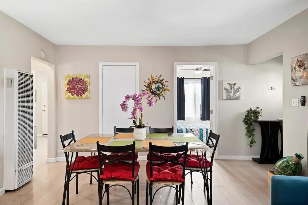 a dining room with a table and chairs at Spacious Centrally Located NEW 2 Bedroom Property! in Inglewood