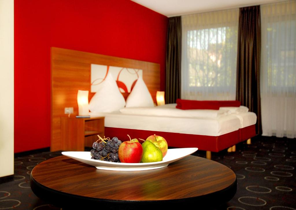 Postel nebo postele na pokoji v ubytování Hotel Central